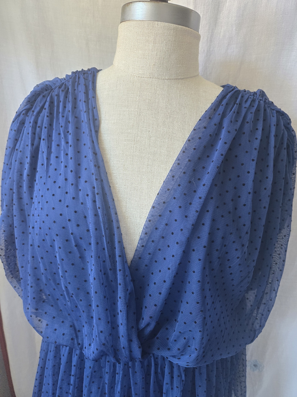 Anthropologie blue mesh babydoll blouse featuring a deep V-neck, short